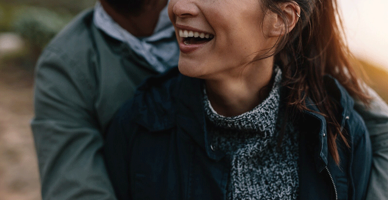 A close up of a couple embracing while laughing about something. This could represent the bonds cultivated after working with an online therapist in Ontario to find relationship fulfillment. They can help you create a fulfilling relationship in Ontario, CA, and other more.